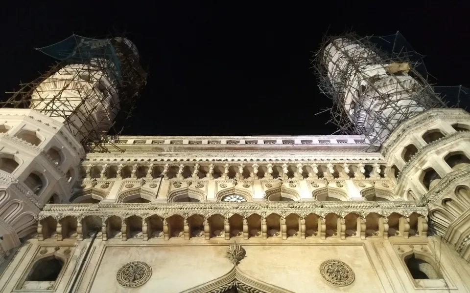 Charminar illuminated at night in Hyderabad.